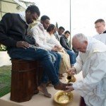 Pope Francis washes the feet of Muslim migrants.