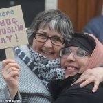 People build chain outside mosques to fight islamophobia on so called punish a Muslim Day.
